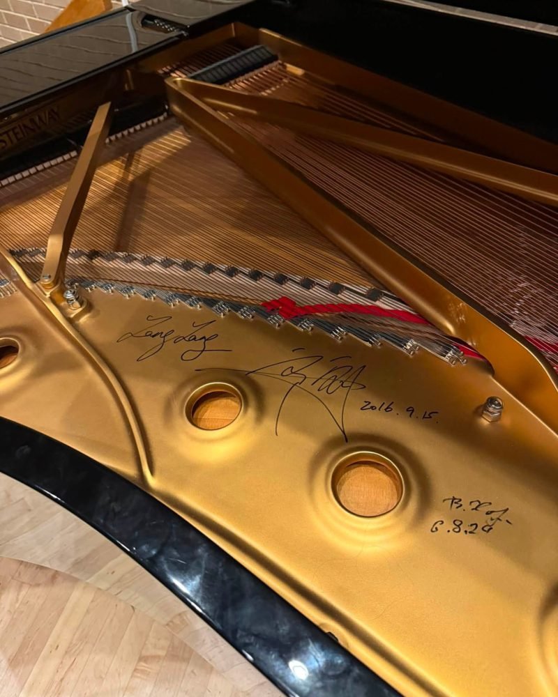 Gold-painted plate of a Steinway grand piano signed in marker by pianist Lang Lang
